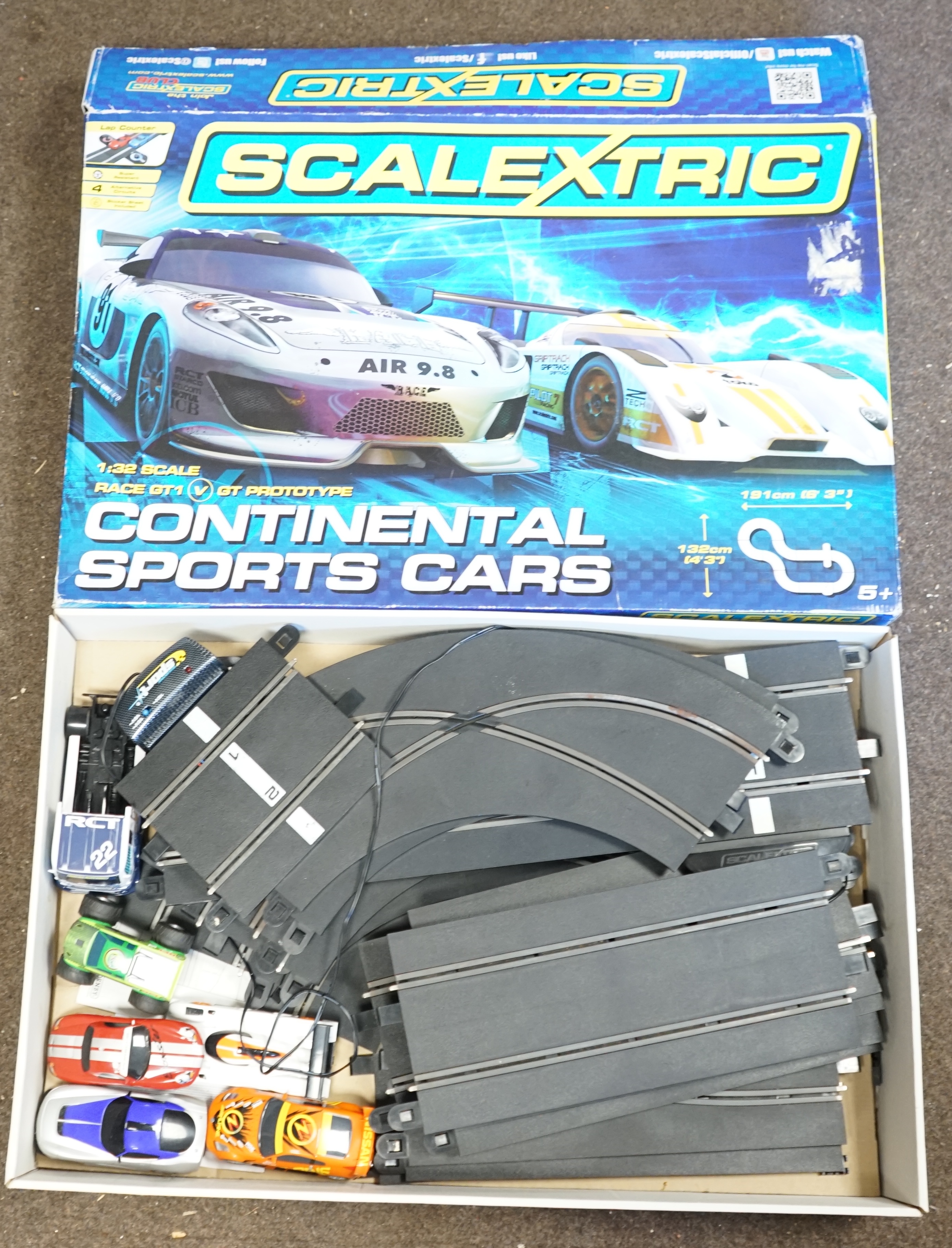 Two Scalextric sets; Le Mans 24 and Continental Sports Cars, together with a few additional cars (seven cars and an articulated tractor unit in total), plus a Track Extension Pack. Condition - fair, some accessories miss